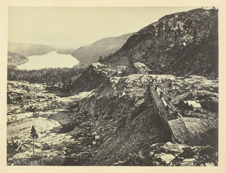 Summit of Sierra Nevada, Snow Sheds in Foreground, Donner Lake in the Distance, C. P. R. R.: photograph by Andrew J. Russell, 1868/69.