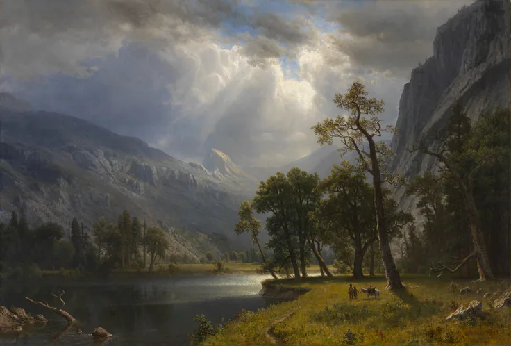 Sunbeams break through clouds onto a granite valley; a still lake, dark pines and a golden meadow with two tiny riders in the foreground.