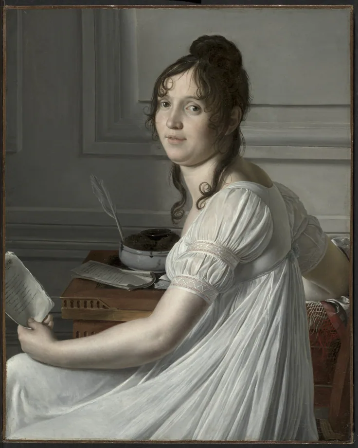 A young woman in a white Empire dress turns from her desk with a letter in hand; cool grey panelled wall and soft daylight.
