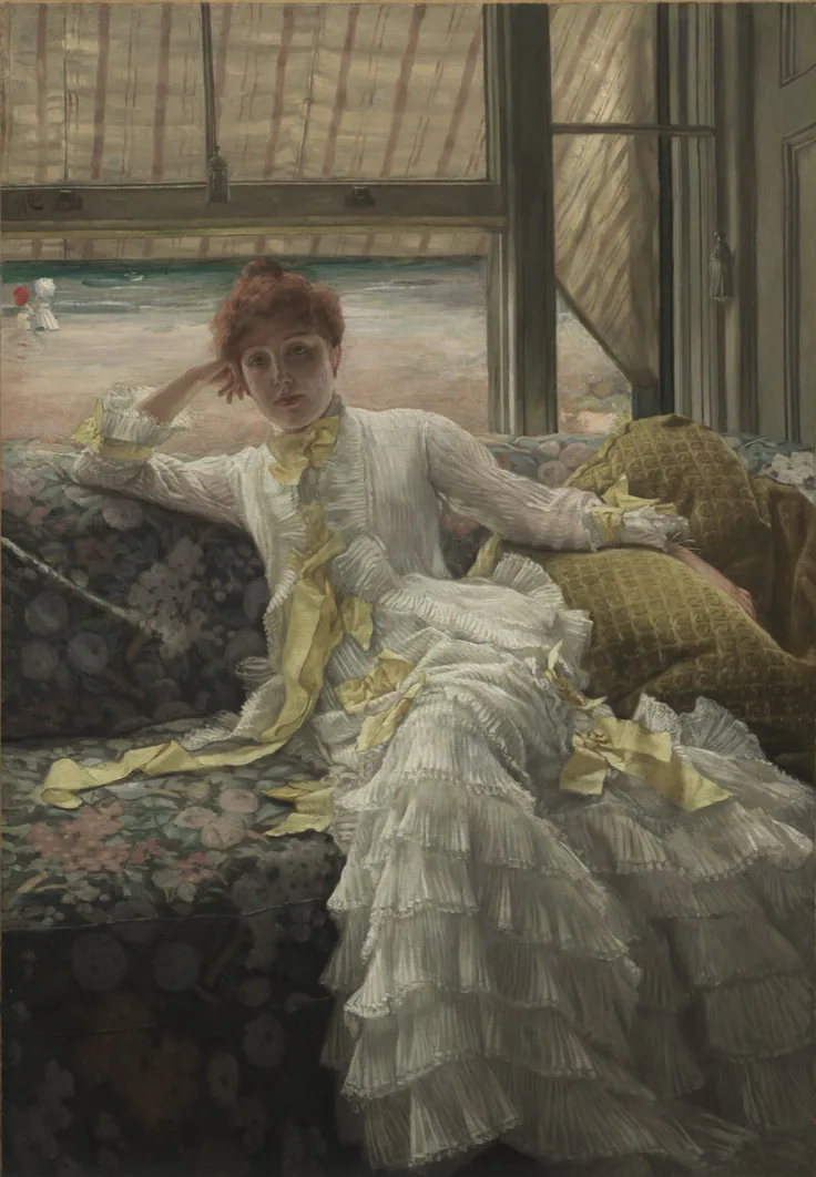 A red-haired woman in a white ruffled dress lounges on a patterned sofa; striped awnings and a bright beach behind her.