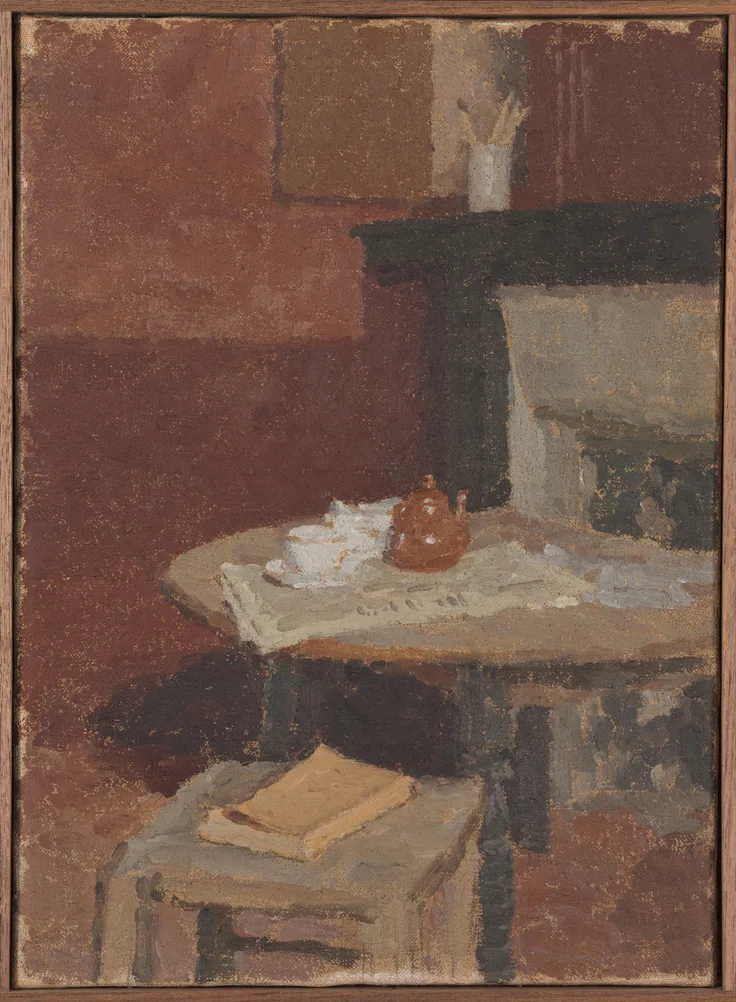 A quiet corner with a teapot and white cup on a round table, a book on a chair and a dark mantel; dry, chalky reds, greys and browns.