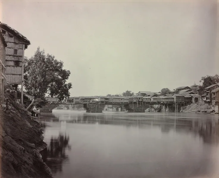 Bridge of Shops, Srinagar, Kashmir: albumen print from wet collodion negative by Samuel Bourne, 1864.
