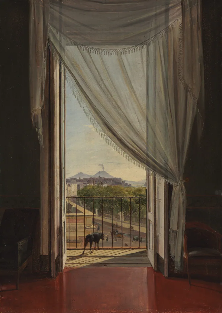 Sheer curtains frame an open balcony door onto sunny Naples and smoking Vesuvius; a polished red floor and a dog on the balcony.