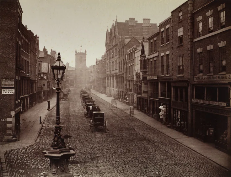 A long cobbled street of brick shops with a gas lamp in front and horse cabs waiting; warm sepia light.