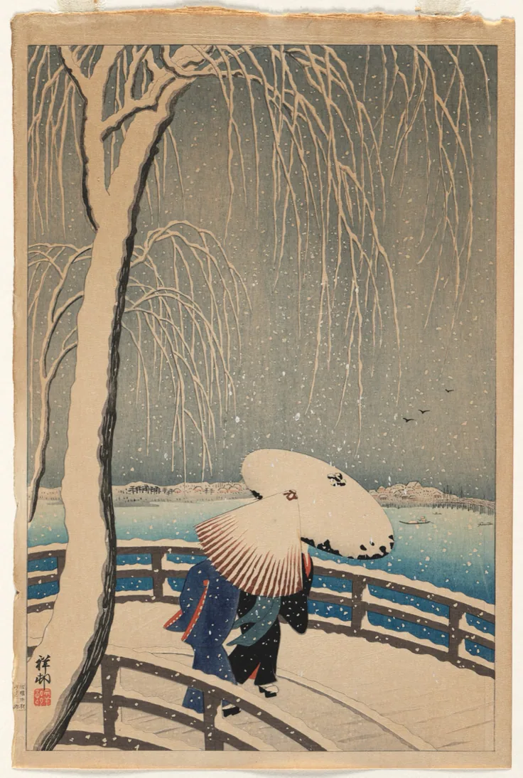 A figure under a snow-covered umbrella crosses a bridge as snow falls past a drooping willow; soft blue-grey sky.