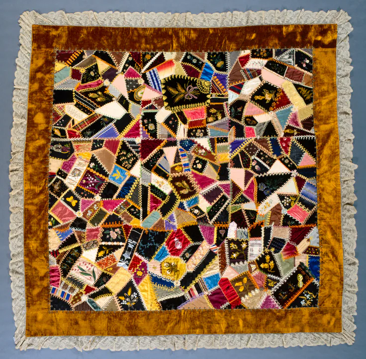Crazy Quilt: silk, ribbons, lace, velvet, embroidered, heat transfer by Louisa Joiner, c. 1887–1900.